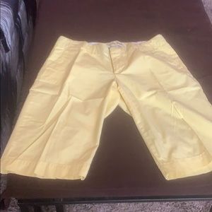 Light weight yellow shorts with deep pockets..